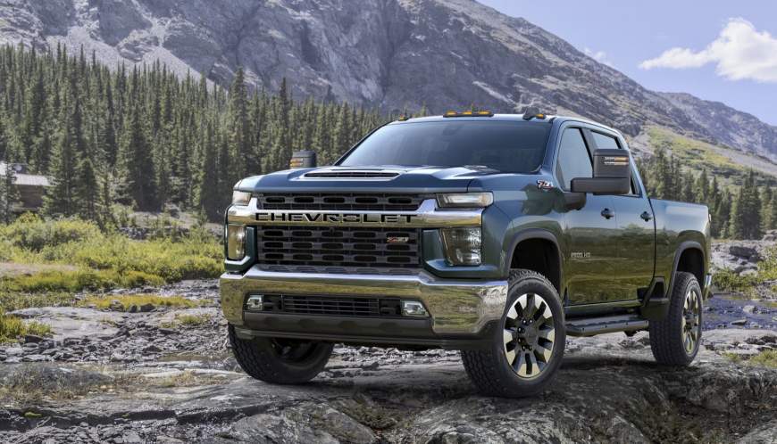 What range does a Chevy Silverado have according to its engine type and tank size?