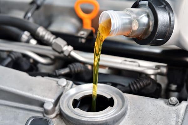 motor oil pouring in engine